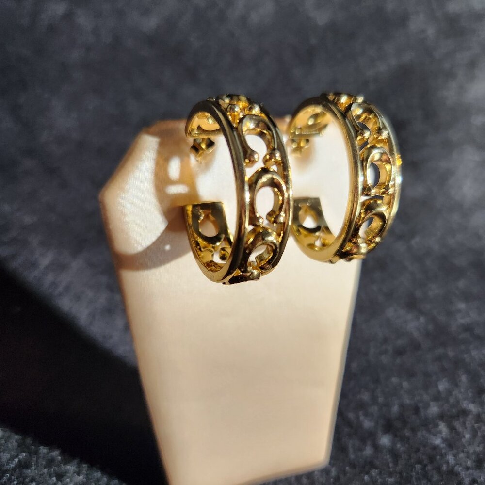 Pair of COACH Signature C openwork Logo pierced Open Hoop gold tone earrings